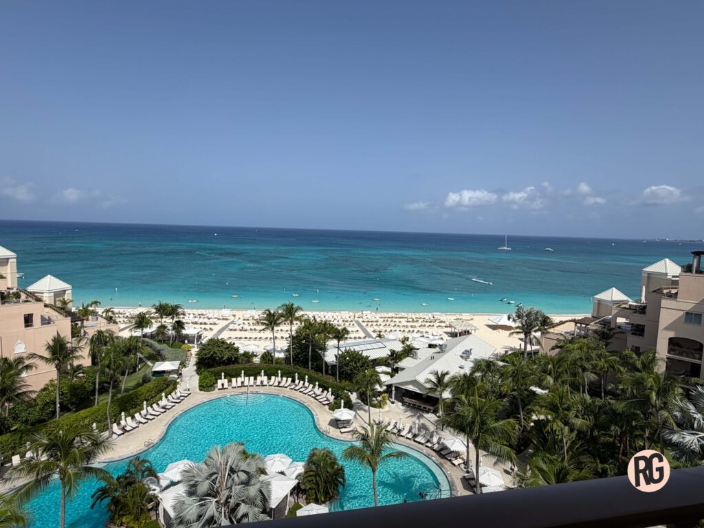 Crystal-clear turquoise water along Seven Mile Beach at The Ritz-Carlton Grand Cayman on a sunny Caribbean afternoon.